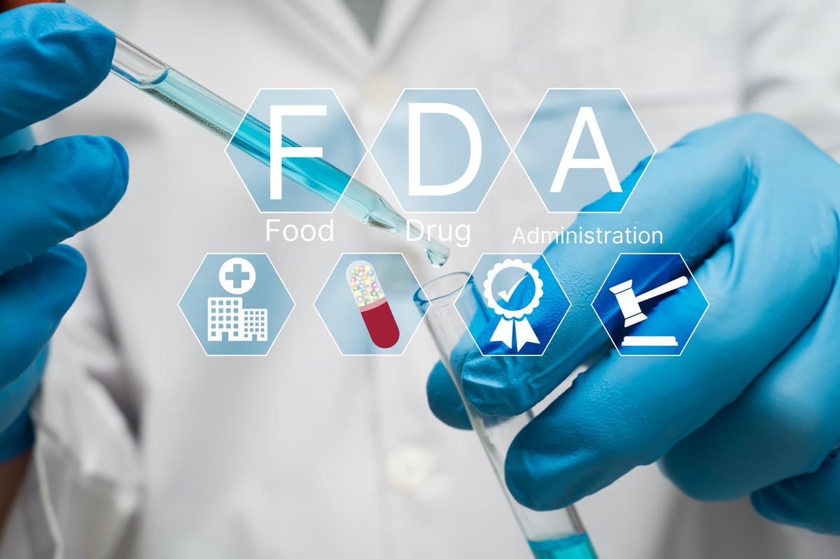 Scientist with blue gloves using pipette and test tube in laboratory with FDA approval icons